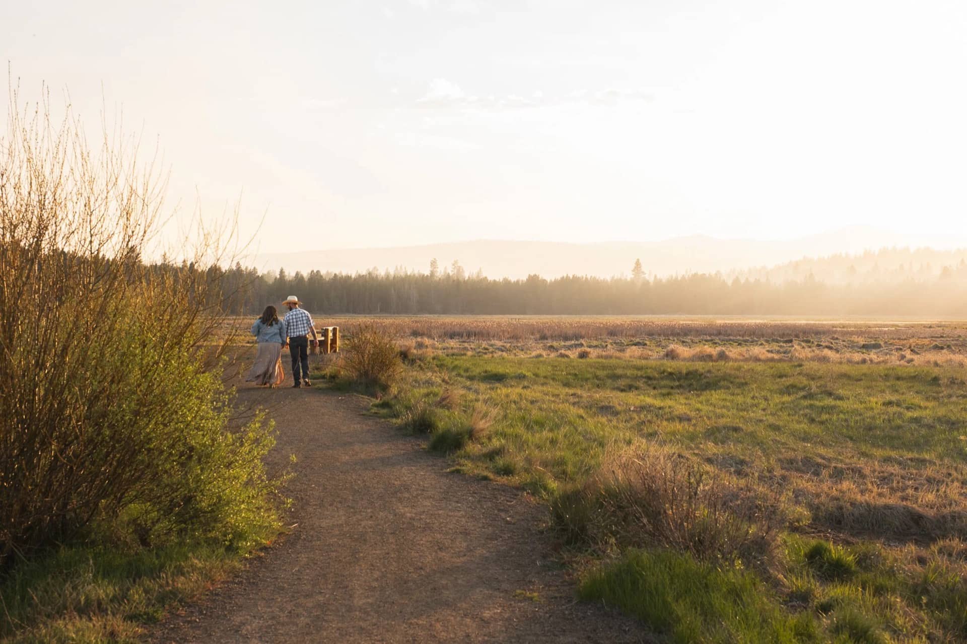 Alexandria and William walking at golden hour